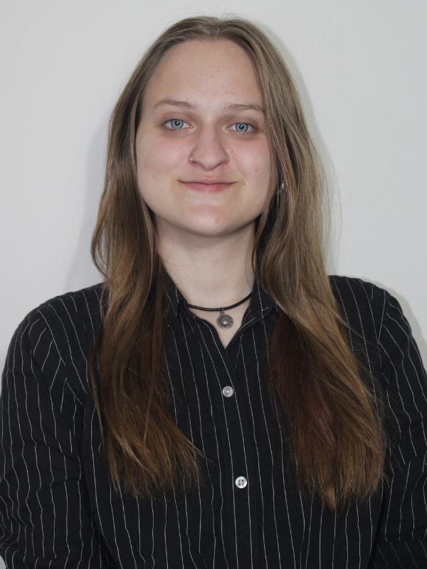 Headshot of Lorelei Herman posed in front of a white background