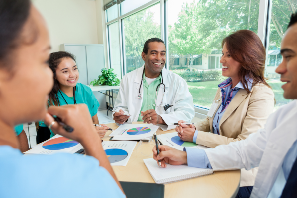 A group of health professionals sitting around a table