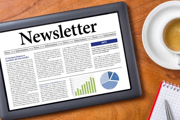 A tablet that says "Newsletter"