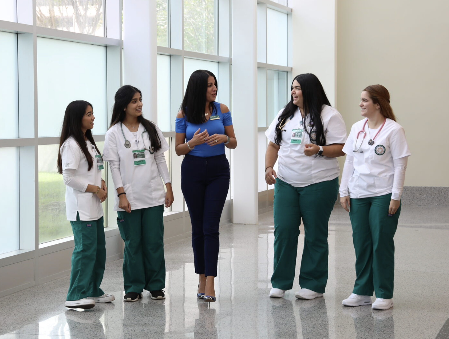 Freshmen walking with advisor
