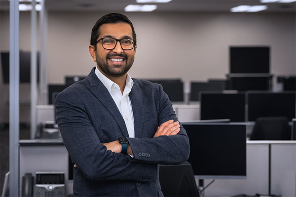 Dr. Nishit Patel of USF Health Dermatology posing with his arms crossed