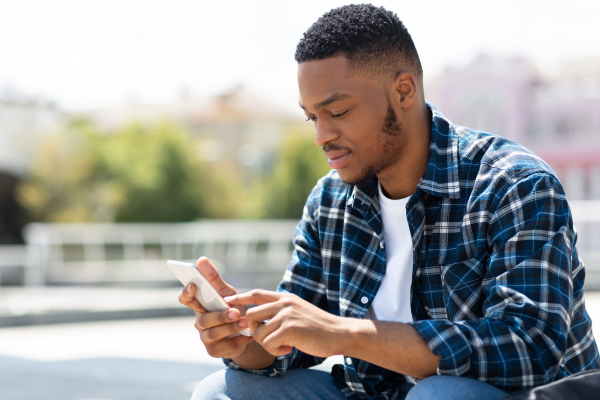 A man looking at his smartphone