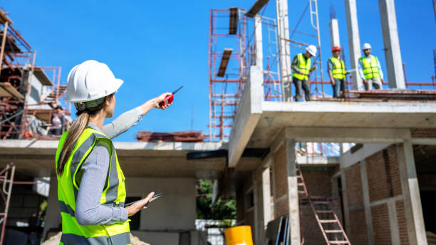Workers wearing hard hats in a construction zone