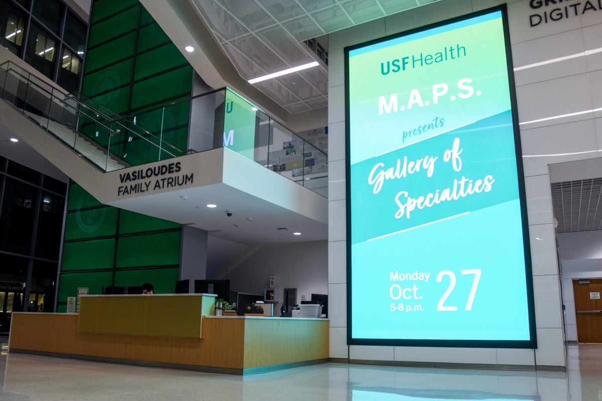 Large digital sony way displays digital graphic that reads "USF Health M.A.P.S presents Gallery of Specialties Monday Oct. 27 5-8PM"