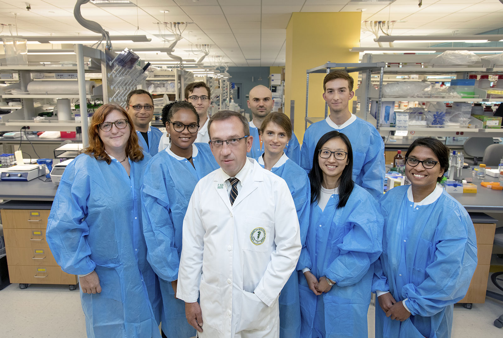 USF Health Hypertension and Kidney Research group of researchers with blue medical lab coats