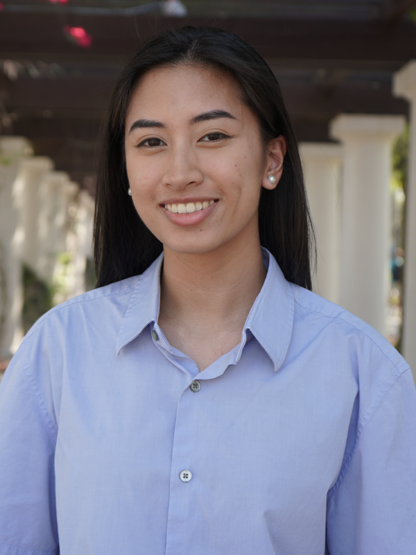 Headshot of Parker Guevarra posed in front of a building