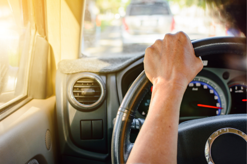 A person driving a car