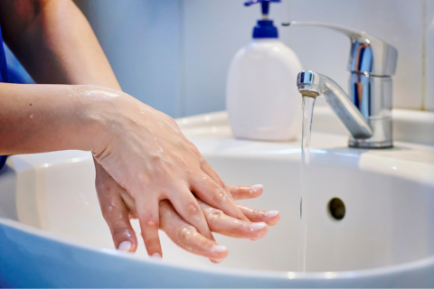A person washing their hands