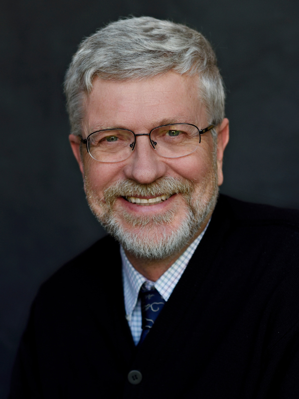 Headshot of Dr. Sten Vermund smiling in front of a dark backdrop.