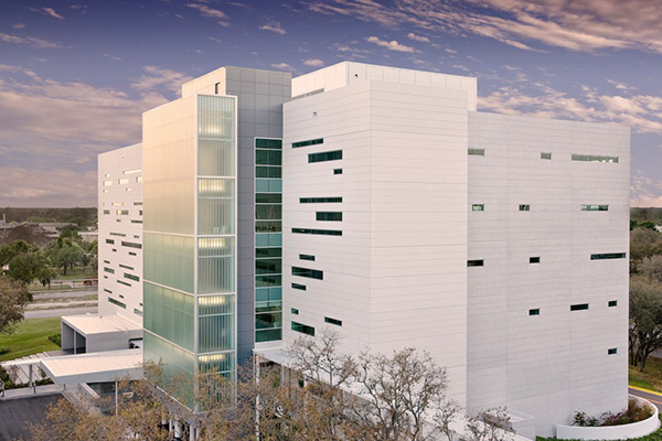 a white six story state-of-the-art professional building located on the northwest side of the USF campus at 13330 USF Laurel Drive.