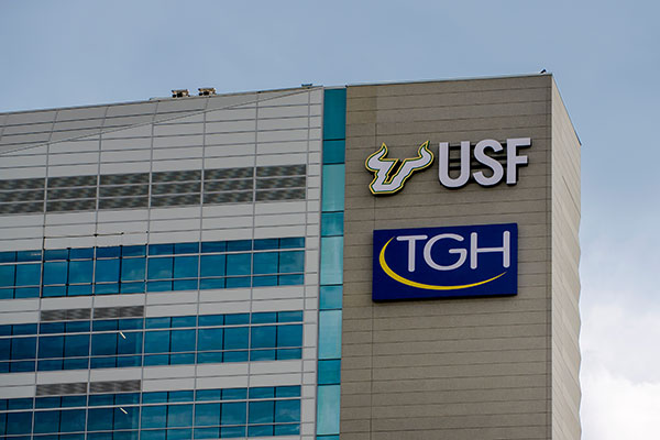 Close up of a Tampa General Hospital building that displays the USF logo