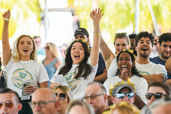 A group of students cheering outdoors during Match Day