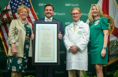 Dr. Charlie Lockwood, and USF President Rhea Law & Rep. Adam Anderson group photo